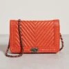 What Goes Around Comes Around Chanel Orange Calf Braid Boy Bag